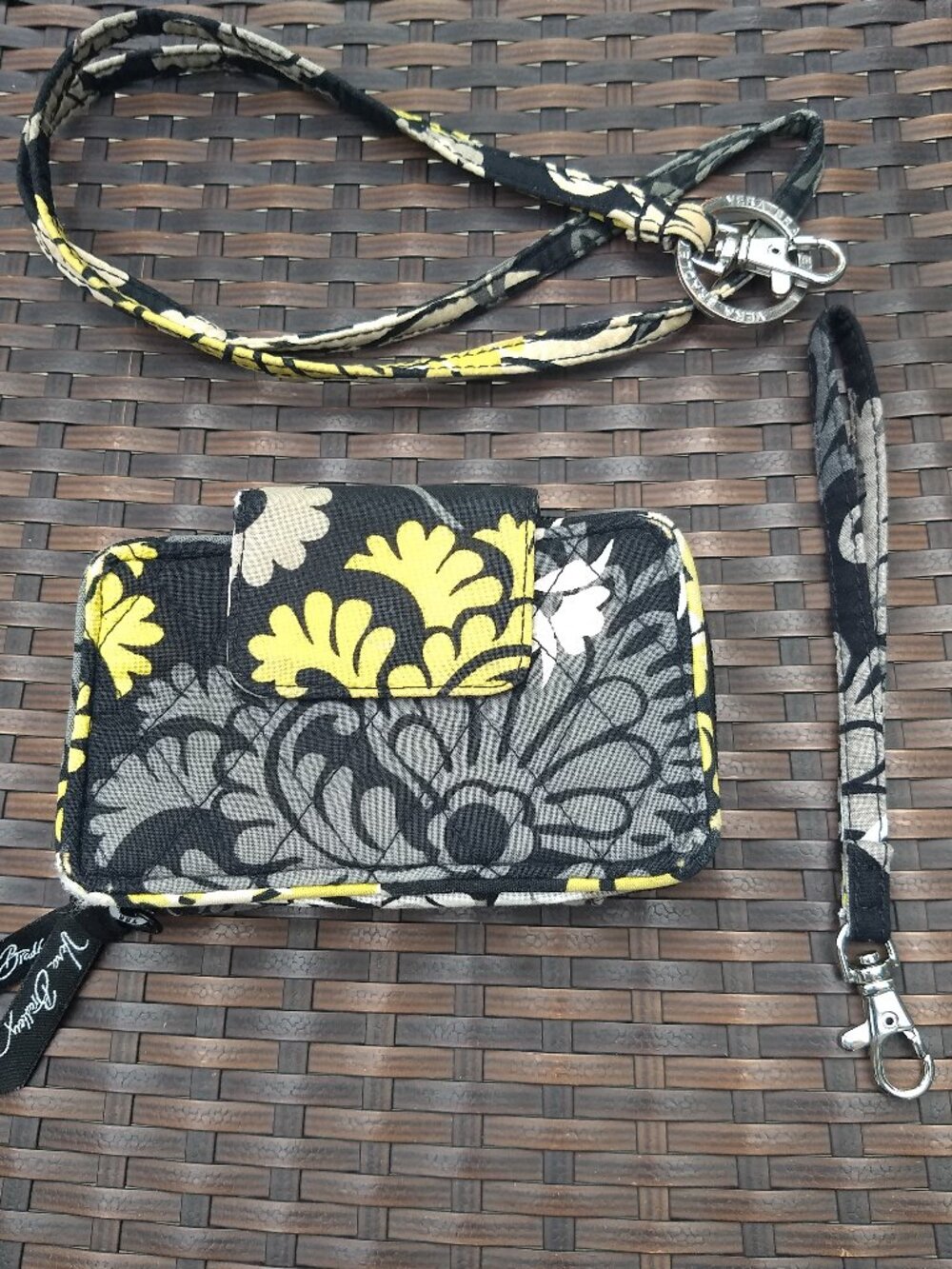 Vera Bradley Wallet with wrist and neck straps.